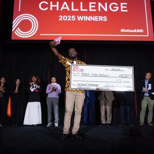 College of Education Ph.D. student Ebenezer Kobina Mensah accepts the $10,000 top prize in the Founders track at UMD's 2025 Do Good Challenge.