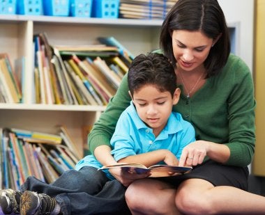 Parent and child reading a book